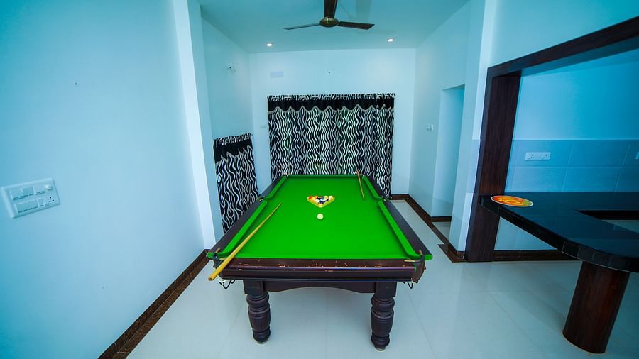 Image of a snooker table with a ceiling fan above it at WOW Bison Woods.